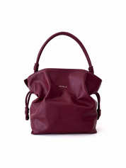 Burgundy handbag with 'Michella' branding on a white background