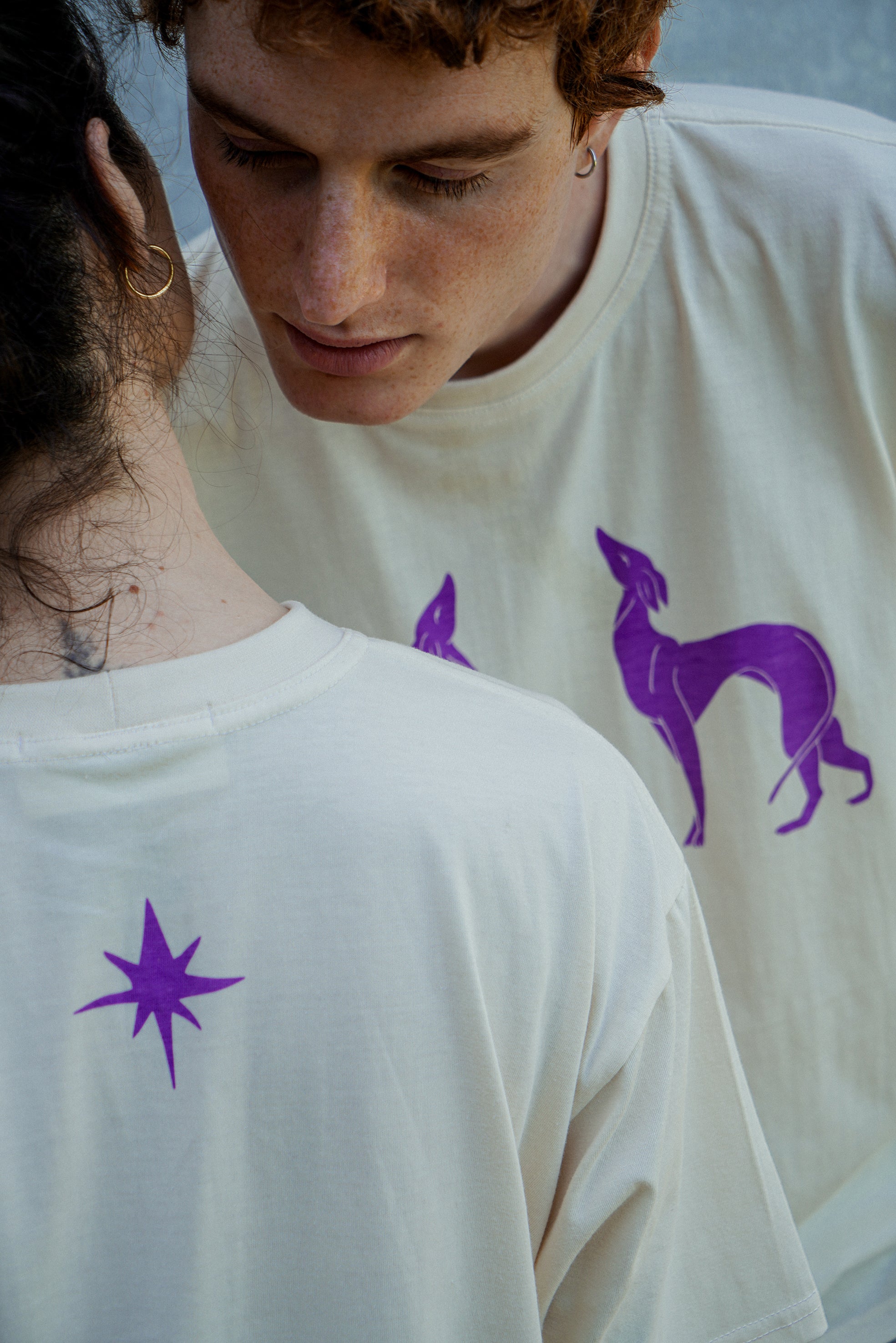 couple wearing athena tshirt with dog illustration